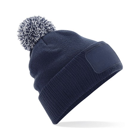 Bonnet à pompon bicolore
