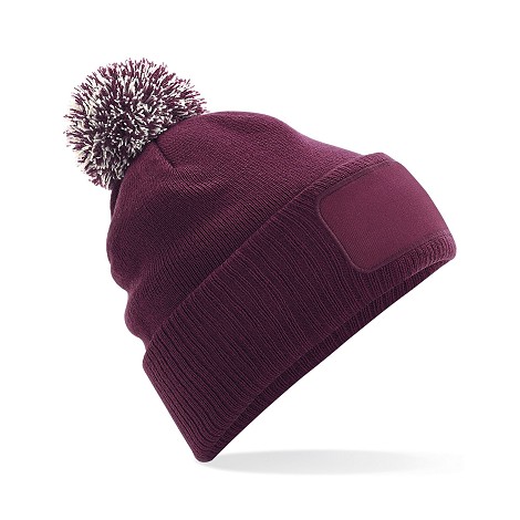 Bonnet à pompon bicolore
